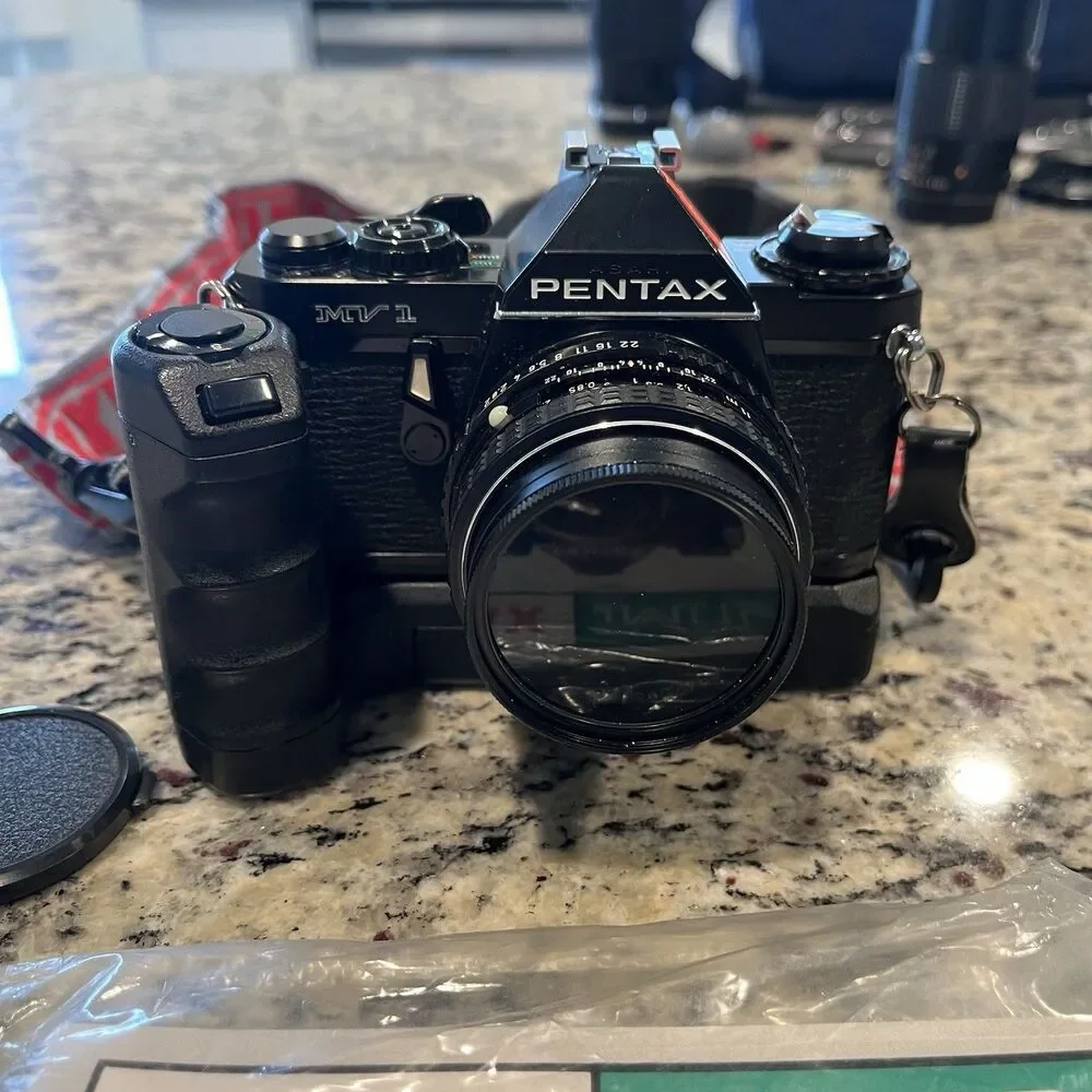 Asahi Pentax MV-1 35mm SLR Film Camera With lens, Mount, Strap and documents